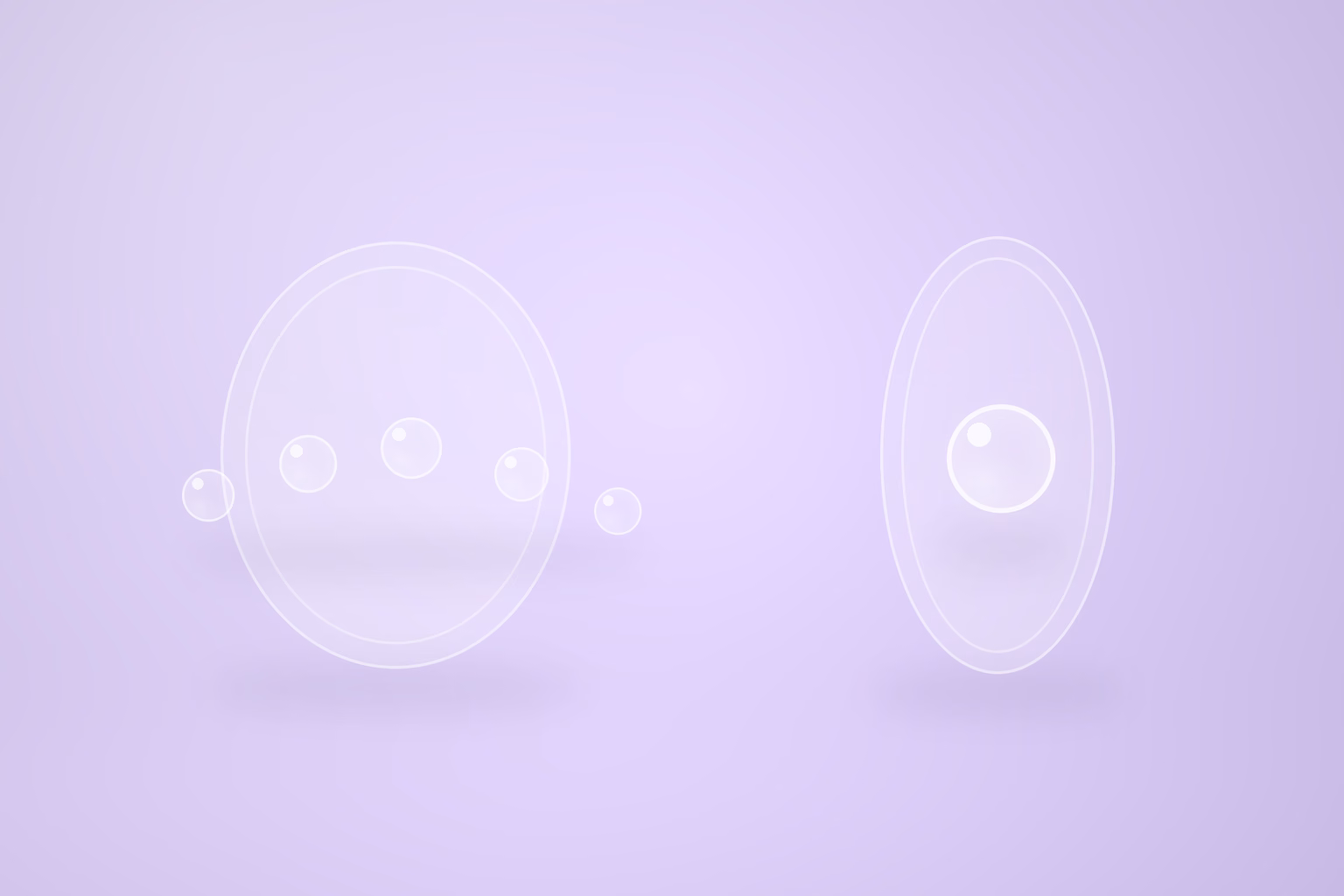 Two frosted glass rings stand on edge on a pale violet floor. The wide ring on the left has a loose line of five small glass spheres passing through it at different heights, and the narrow taller ring on the right holds a single larger sphere.