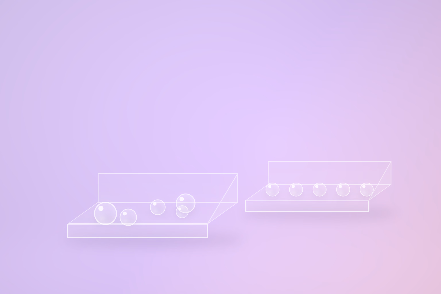 Two shallow translucent glass trays on a pale violet ground. The nearer, larger tray holds five glass spheres scattered at different sizes and depths; the smaller tray set further back holds five evenly spaced spheres in a single row.