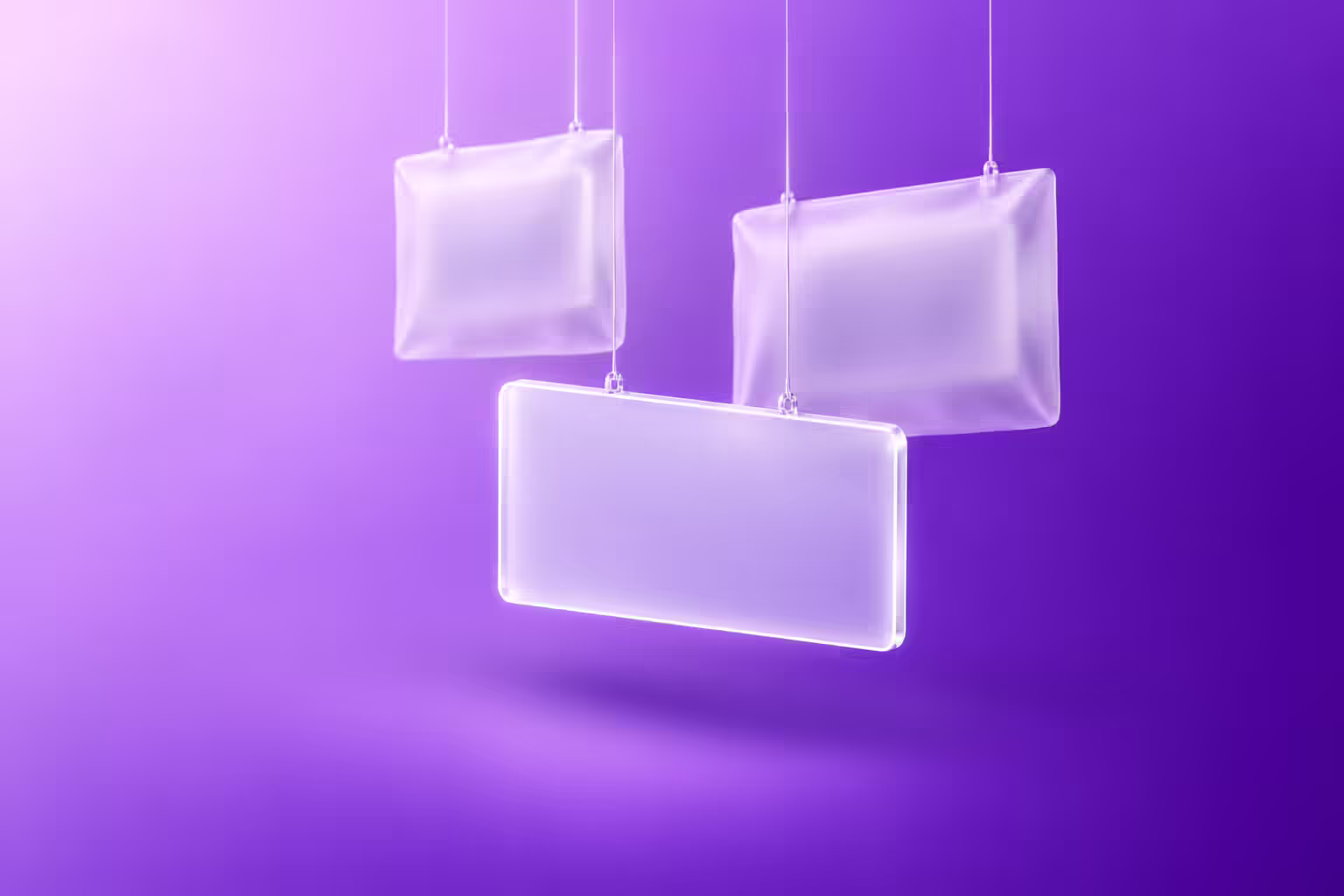 Three frosted glass placards hang on thin threads against a purple gradient, one lit and blank while two are sealed inside opaque white sleeves.