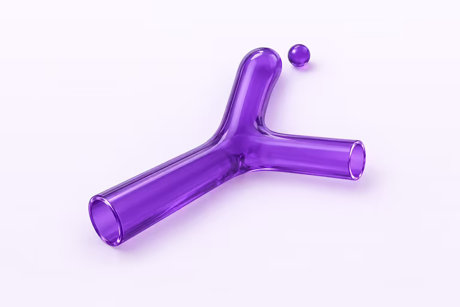A deep purple translucent glass Y shaped pipe junction lying flat on a pale violet ground, its upper branch fused shut with a solid rounded end while the other two ends stay open, and one small glass sphere resting on the ground outside the sealed branch.